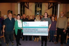 Presenting the donation from money raised at the Christmas concert to The Beacon Centre